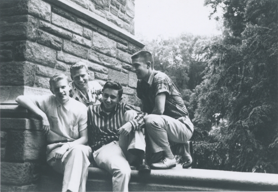 black and white photo of four friends on campus